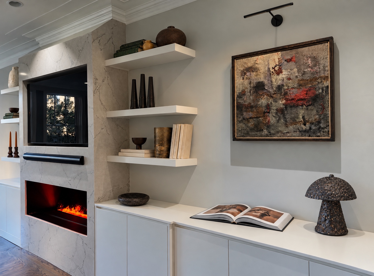 Artwork and sculptural lighting beside a stone fireplace and styled shelves