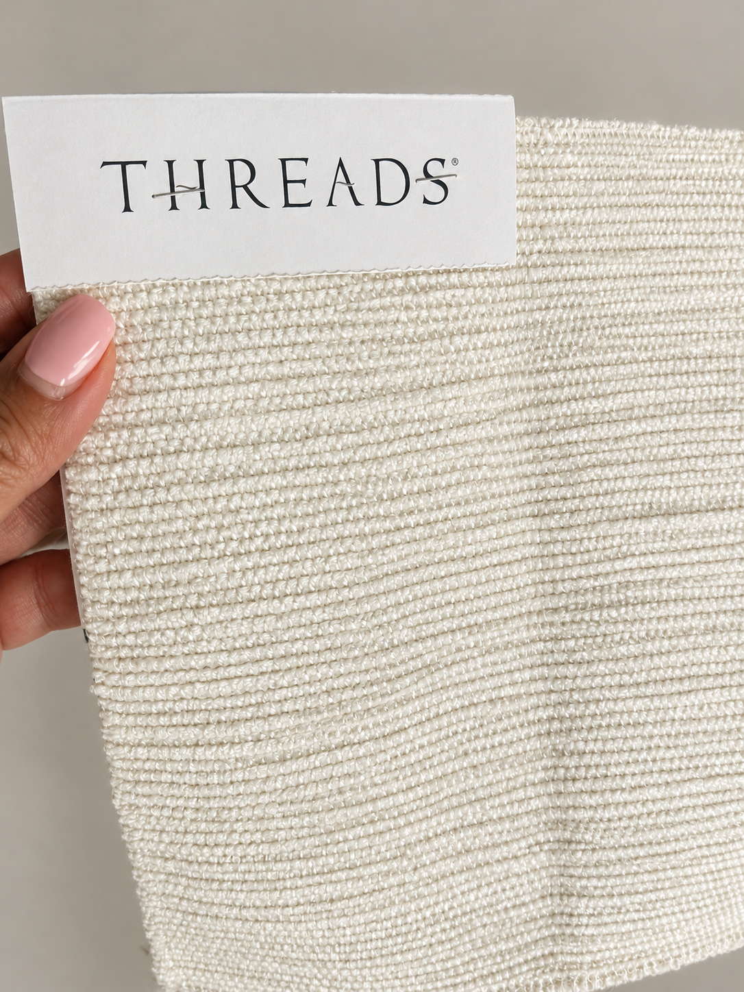 The ivory fabric selection: texture before color.