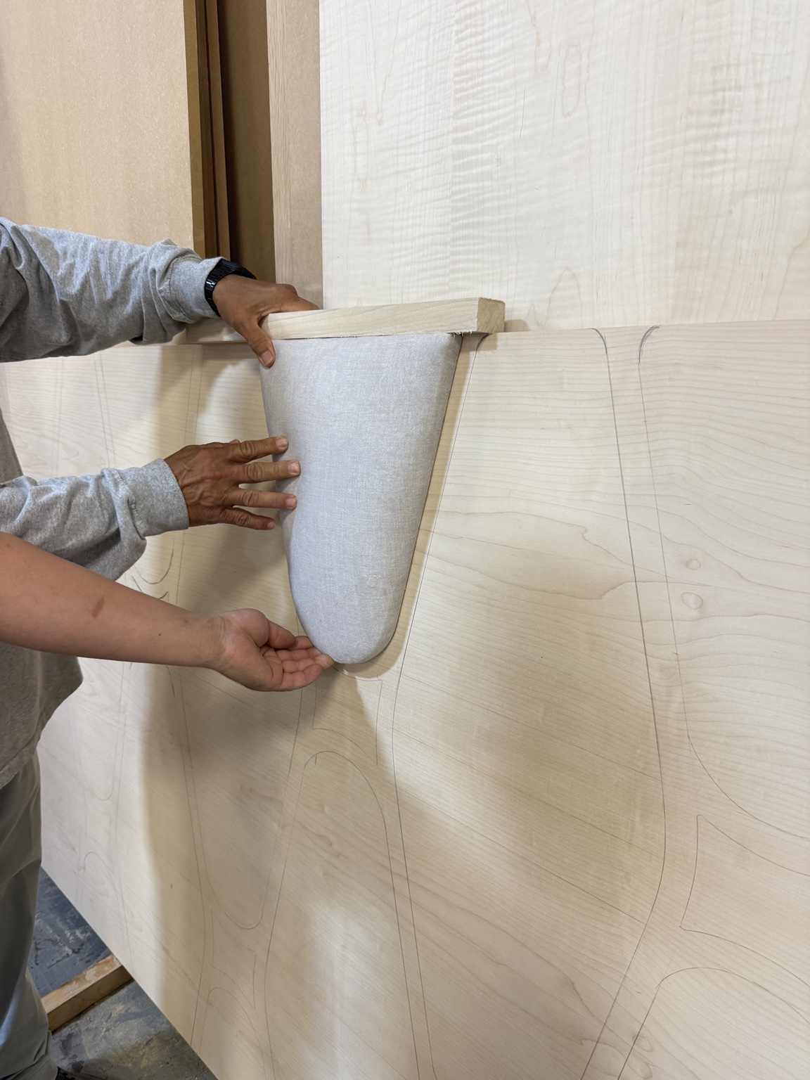 Fitting an upholstered panel against the headboard layout.