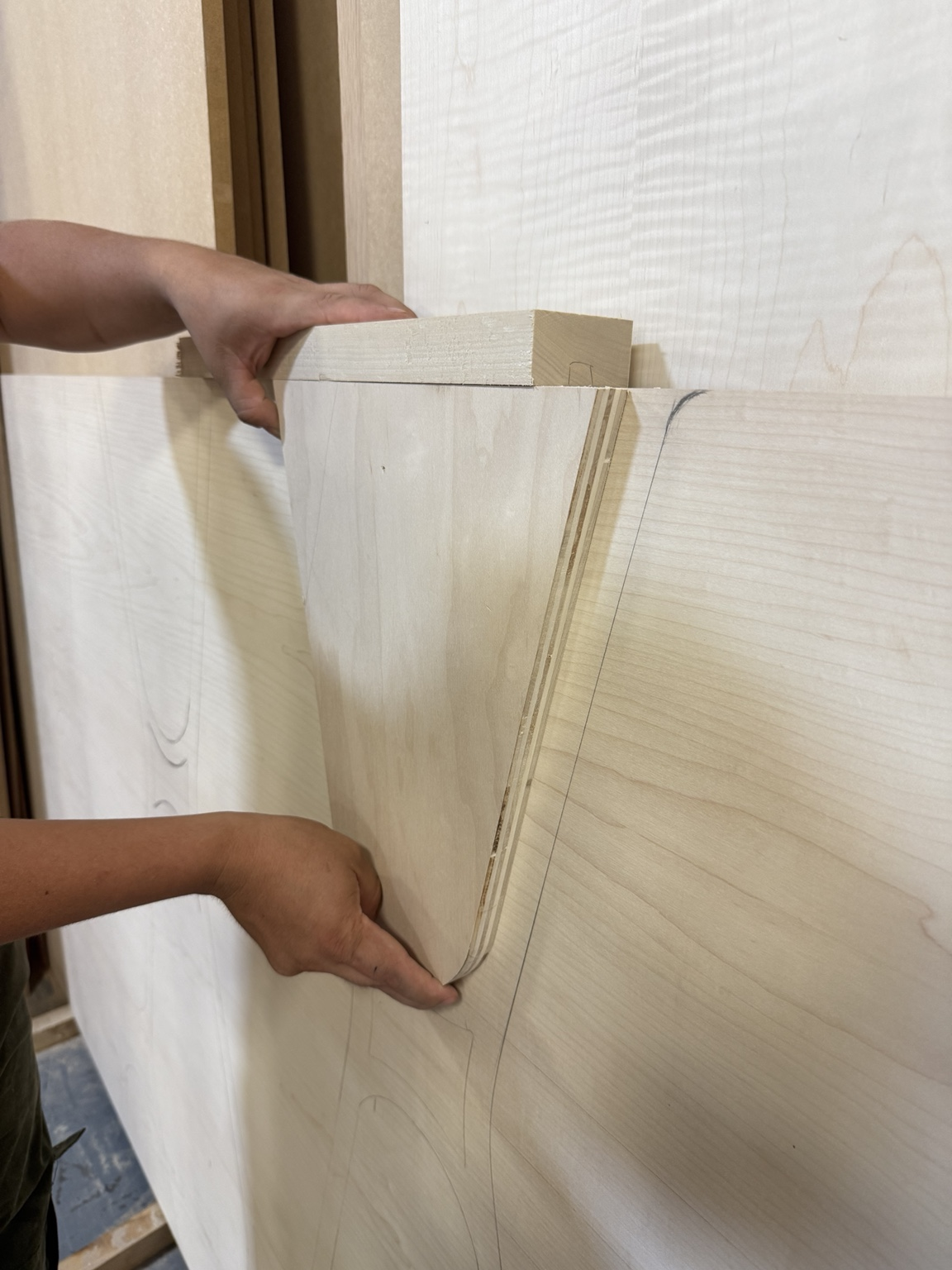Checking the headboard’s curved shapes in wood.