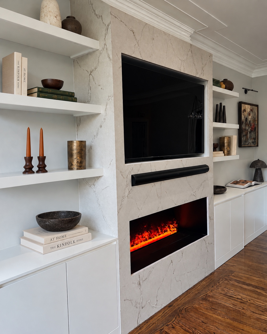 Stone fireplace with floating shelves, curated objects and artwork