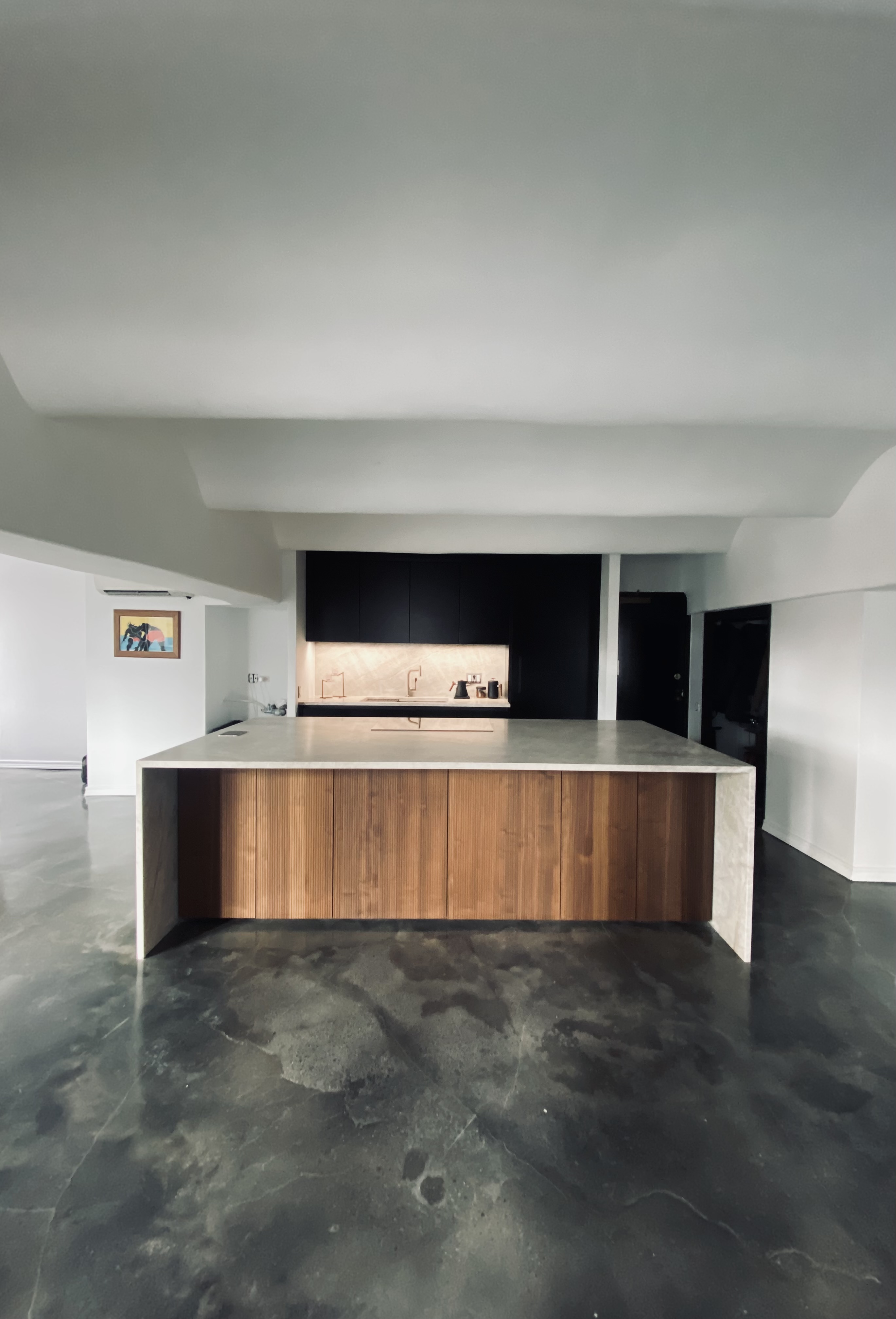 Front view of the Canal Street quartzite island with warm wood cabinet fronts