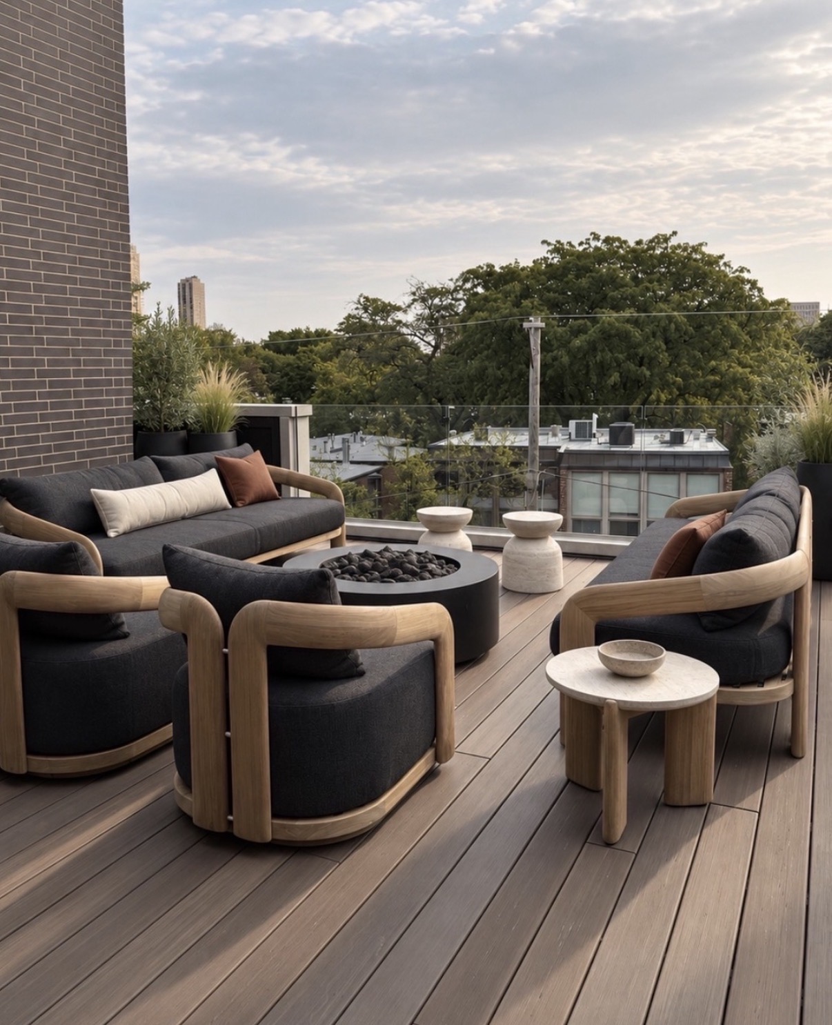 Howe Street patio with sculptural teak furniture, black bouclé and travertine tables