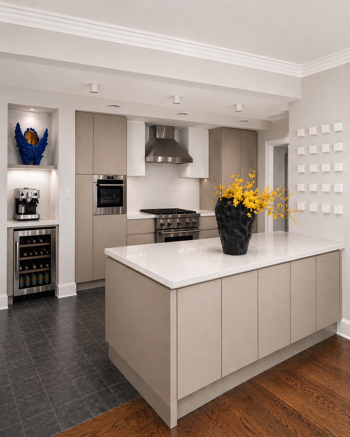 Warm neutral kitchen with an island, stainless steel appliances and sculptural accents